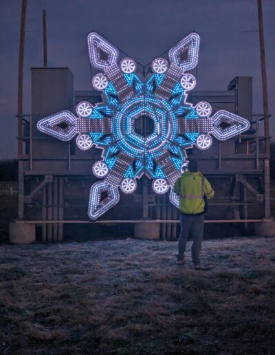 Large blue and white snowflake light display for the Magical Lights of Lincoln family produced Christmas lights show